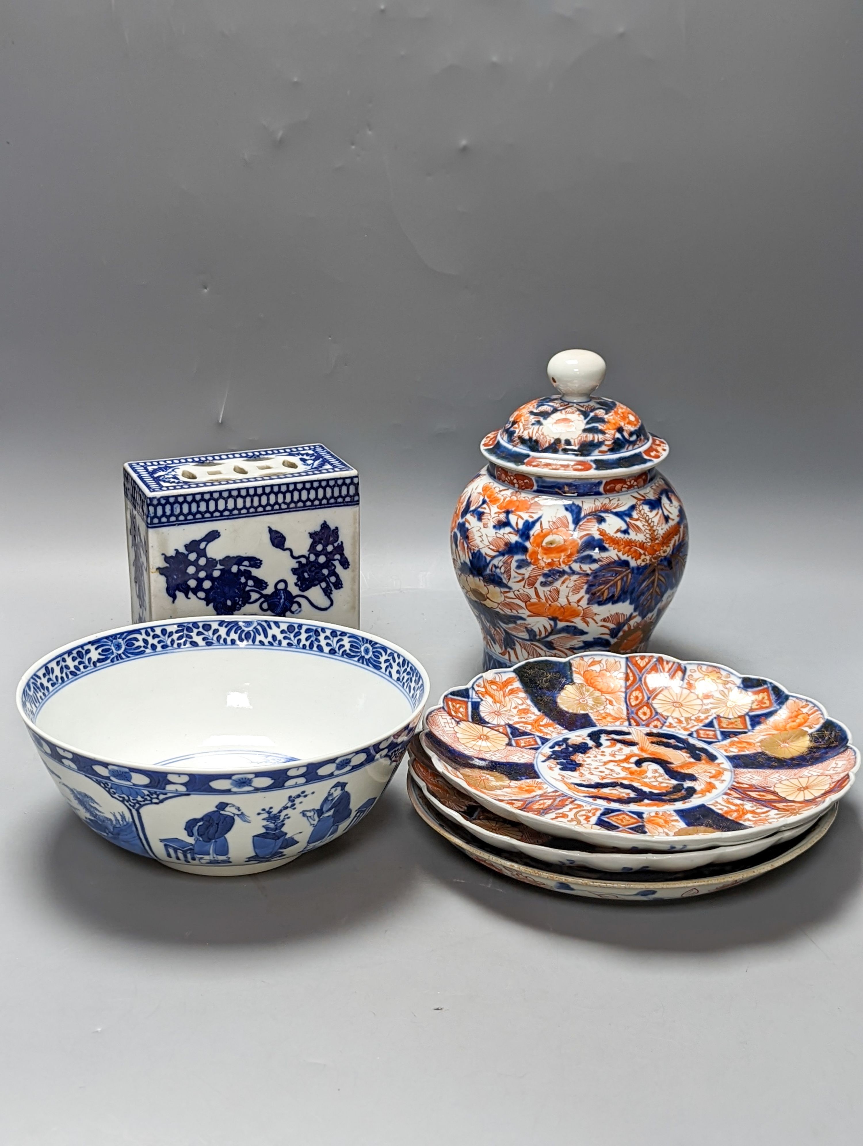 A 19th century Chinese porcelain bowl, transfer printed pillow, a Japanese Imari jar and cover and three Imari plates 21cm
